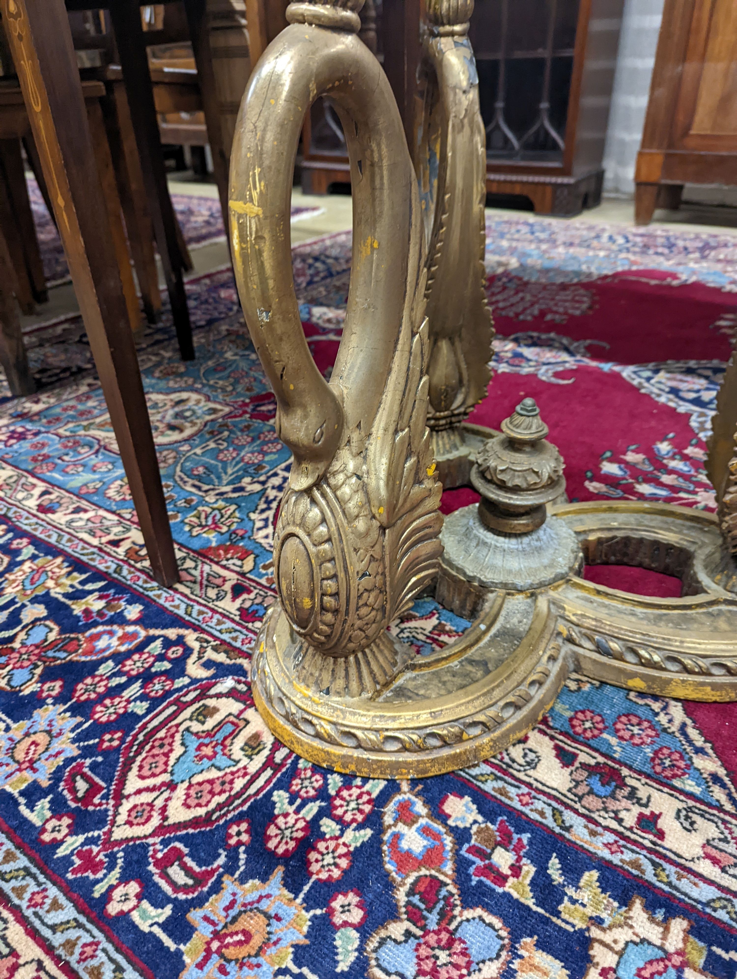 A pair of Empire style circular glass top gilt metal ‘swan’ occasional tables. D-69cm, H-55cm.